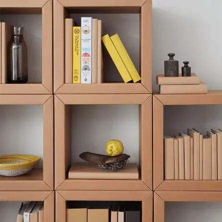 A sturdy shelf made out of folded cardboard boxes.