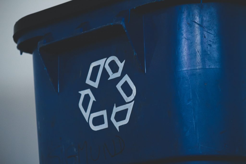 blue recycling bin with symbol
