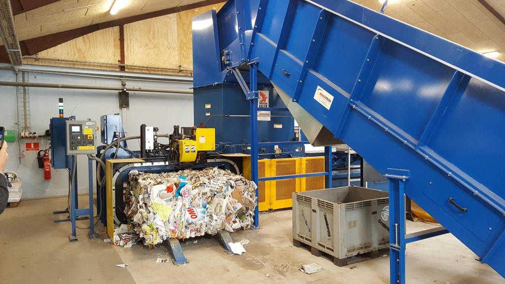 Paper baler in a warehouse