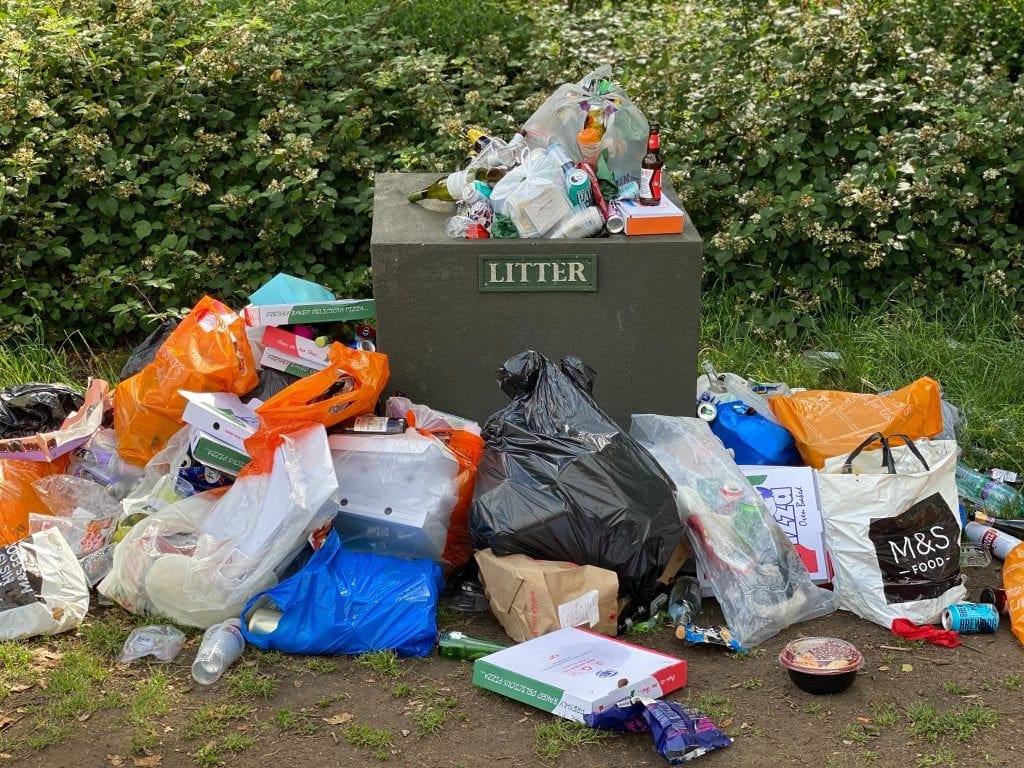 garbage can overflowing with waste